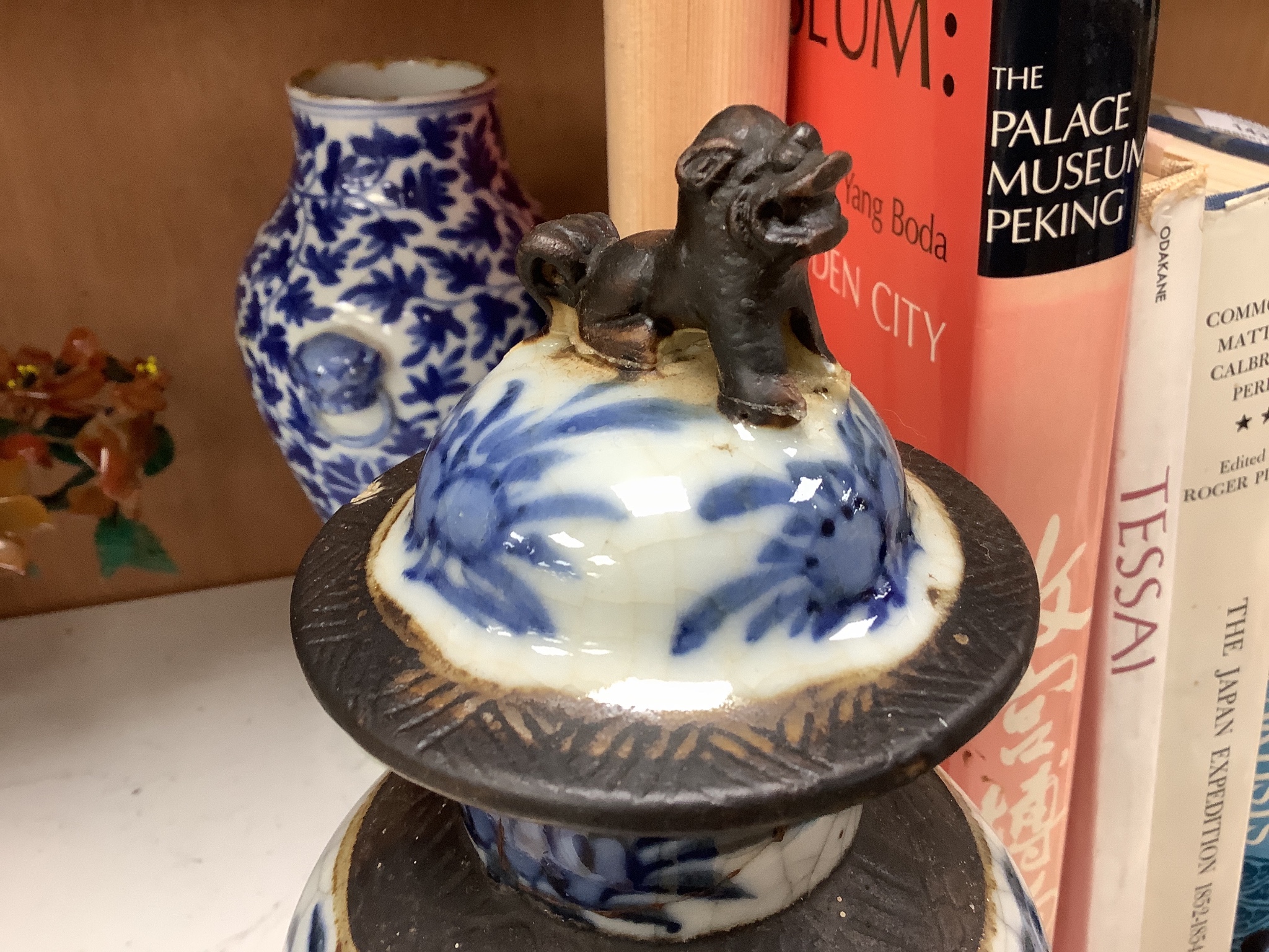 A 19th century Chinese blue and white vase, a similar crackle glaze vase and a powder blue jar, mounted as a lamp, tallest 32cm